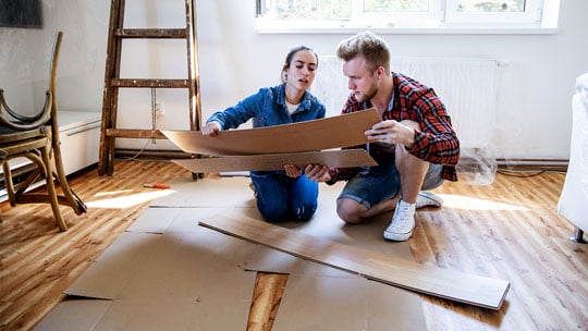 Couple compares flooring options for a home improvement